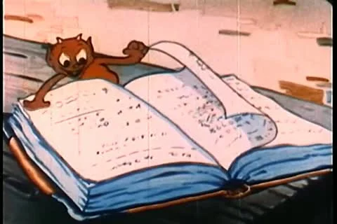 Demon reading a book Stock Footage 11345540