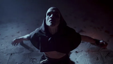 Demonic Monk in a Satanic Ceremony looking up Stock Footage 259823628