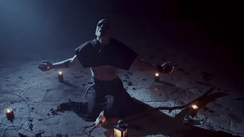 Demonic Monk in a Satanic Ceremony spreading his arms Stock-Footage 259800175
