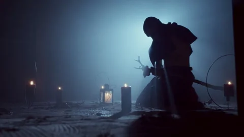 Demonic Monk in a Satanic Ceremony under light Stock Footage 259826332
