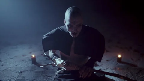 Demonic Monk in a Satanic Ritual calling the devil with a ritual staff 스톡 동영상 259795462