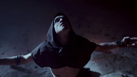 Demonic Monk in a Satanic Ritual calling the devil while spreading his arms Stock-Footage 259796612