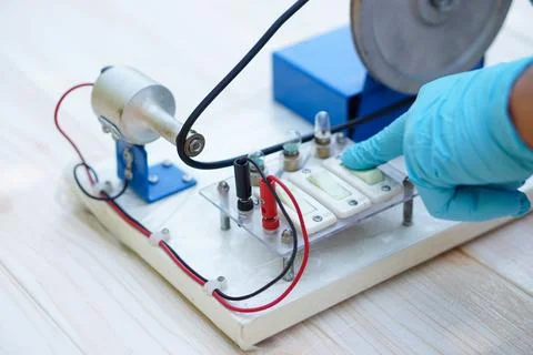 Demonstrate science experiment about electricity circuit from dynamo kit Stock Photos