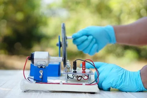 Demonstrate science experiment about electricity circuit from dynamo kit Stock Photos