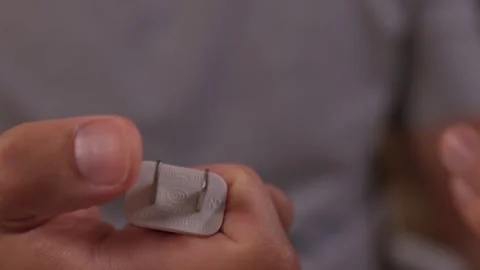 Demonstrating a Cleaning Tool for Sneakers While Showing it in Action and Stock Footage 317061877