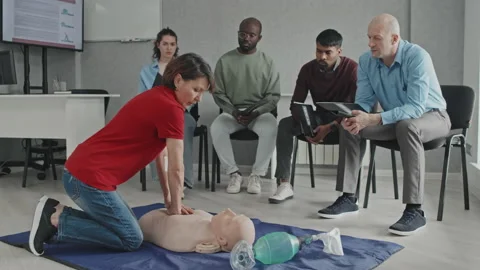 Demonstrating CPR Using Dummy Stock Footage 223932045