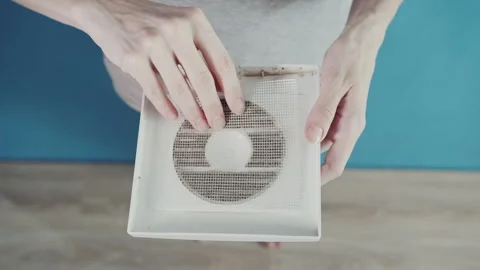 Demonstrating Dust Accumulation on Home Air Vent Mesh Filter Video stock 341397638