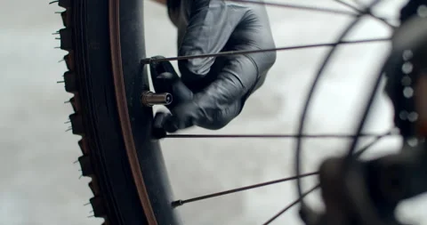 Demonstrating the full process of opening a bicycle tire valve. Stock Footage 311665002