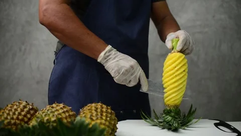 Demonstration of beautiful pineapple peeling Stock Footage 159317426