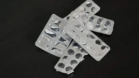 Demonstration of empty pill blisters. The topic of health care, treatment and pr Stock Footage 232147963