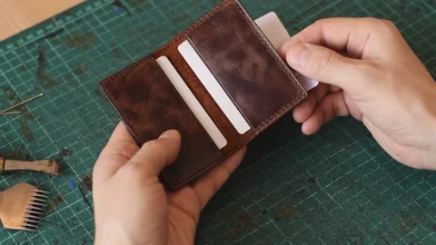 Demonstration of the finished leather cardholder. Stock Footage 150480139