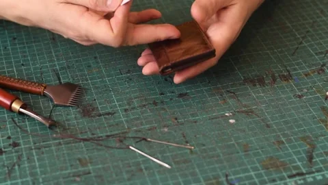 Demonstration of the finished leather cardholder. Stock Footage 150480206