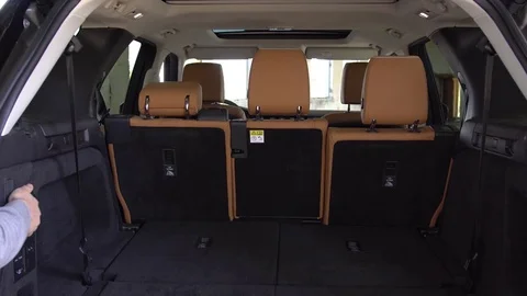 Demonstration of folding backseat technology in mini van vehicle. Stock Footage 82010154
