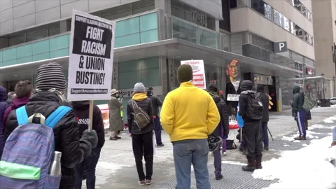 Demonstration in front of Morgan Lewis draws crowd despite bitter cold. Stock Footage 317549497