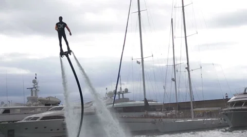 A demonstration of how you use a Flyboard-Jet pack during the Genoa Boat Show Stock Footage 58049749