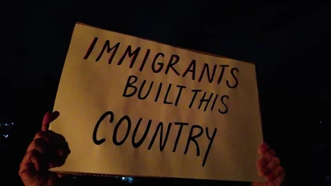 Demonstration by immigrant rights protesters against deportations policies Stock Footage 315619041