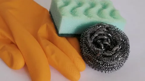 Demonstration of kitchen care products: kitchen and metal sponge, protective glo Stock Footage 233353843