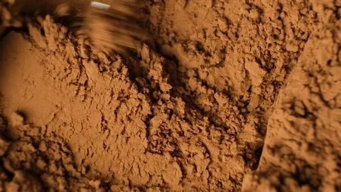 Demonstration of macro texture of natural organic cocoa powder top view. Stock Footage 334872764