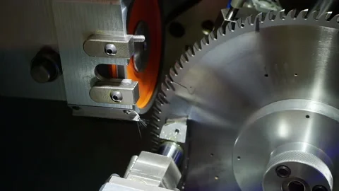 Demonstration of a miter saw sharpening machine. Video stock 143599552
