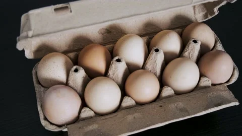 Demonstration of an open tray with eggs. Close-up Stock Footage 233275508