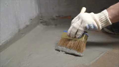 Demonstration of the painted surface with a waterproof paint by cushion and.. Stock Photos