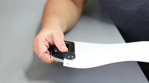 Demonstration of Paper Punching Tool Stock Footage 284207270