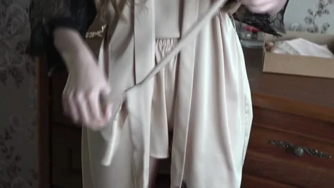 Demonstration of a peignoir by a young model. Stock Footage 88104556