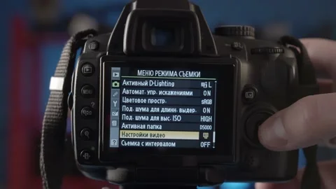 Demonstration of the settings of the different shooting modes on the camera. Stock Footage 234541514