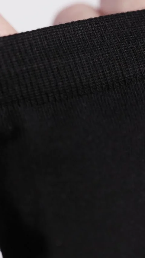Demonstration of the structure of black socks Stock-Footage 236946601