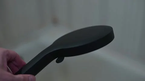 Demonstration of a versatile shower head with interchangeable features. Stock Footage 339090564