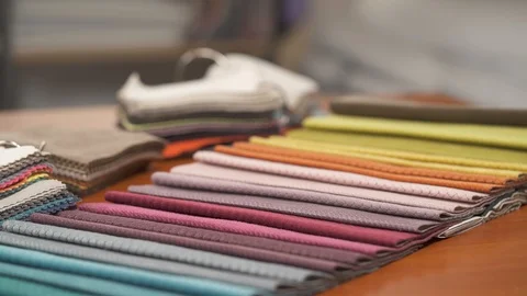 Demonstration video of the colorful tissue samples, choice of fabrics. 스톡 동영상 105476517