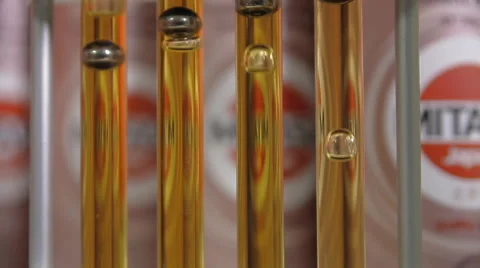 A demonstration of the viscosity of engine oil Stock Footage 64526069