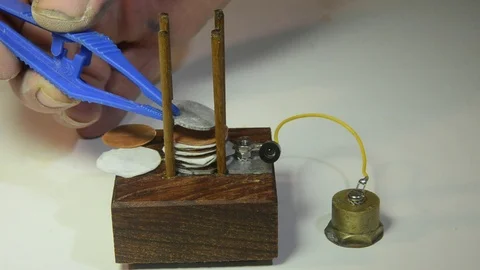 Demonstration of a Volta column Stock Footage 90370843