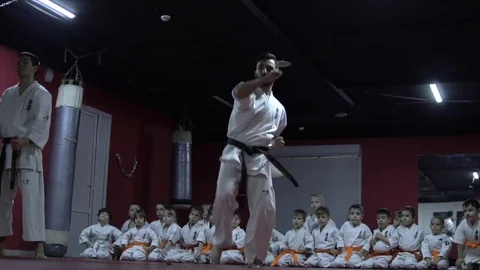 Demonstrations of karate trainer in front of children 스톡 동영상 85214259