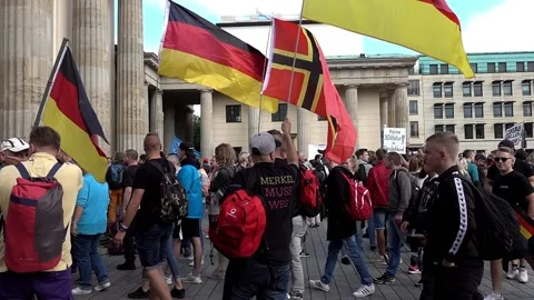 Demonstrators with German flags march on the Anticorona demonstration Stock Footage 138383832
