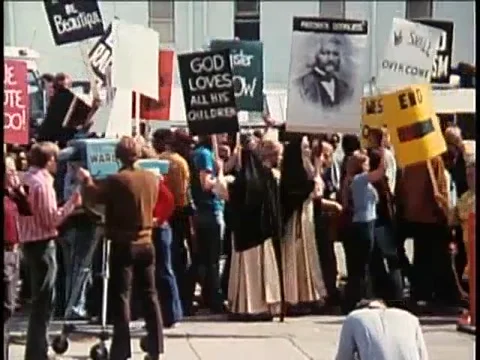 Demonstrators holding signs during protest, 1970s Stock Footage 64630039