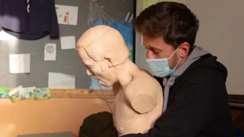 Demostration of what to do when a person is choking Stock Footage 171313346
