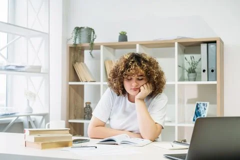 Demotivated student exam study bored woman reading Stock Photos