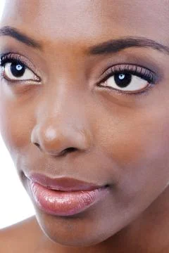 Demure Beauty. Closeup studio shot of a young beautiful african american model Stock Photos