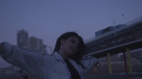 Den Haag Beach Package 2 | woman waving hands like a bird on beach Stock Footage 116186252
