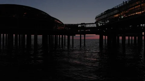 Den Haag Beach Package 25 |Aerial drone flying under through bridge reveal beach Stock Footage 116205902
