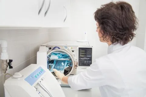 Denatal assistant using Sterilization systems. Preparation instruments for Stock Photos