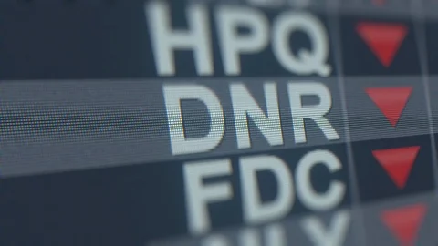 DENBURY RESOURCES DNR stock ticker with decreasing arrow, conceptual Editorial Stock Footage 119619084
