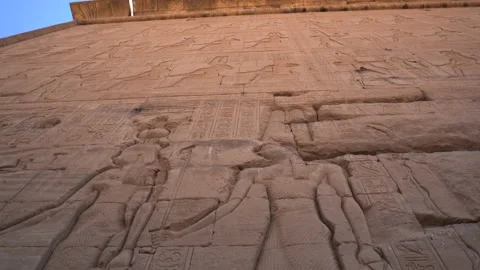 Dendera Temple complex close up of carved stone wall with ancient Egypt Stock Footage 220549410