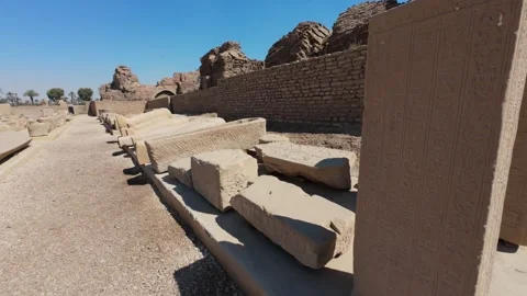 Dendera Temple complex ruins with carved stones and Temple of Hathor in tourist Stock Footage 309755089