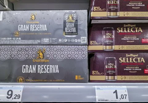 DENIA, SPAIN - Juny 18, 2026.Multi packs of Cruzcampo Gran Reserva and San .. Stock Photos