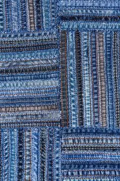 Denim fabric pattern in patchwork style. Stock Photos