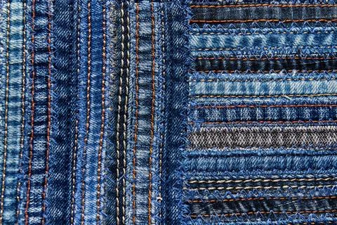 Denim fabric pattern in patchwork style. Stock Photos