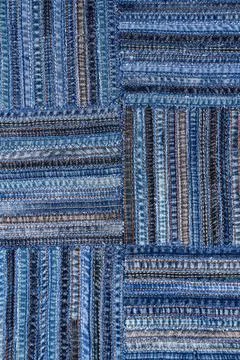 Denim fabric pattern in patchwork style. Stock Photos