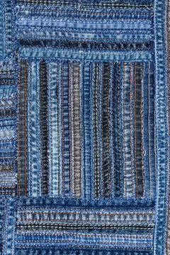 Denim fabric pattern in patchwork style. Stock Photos